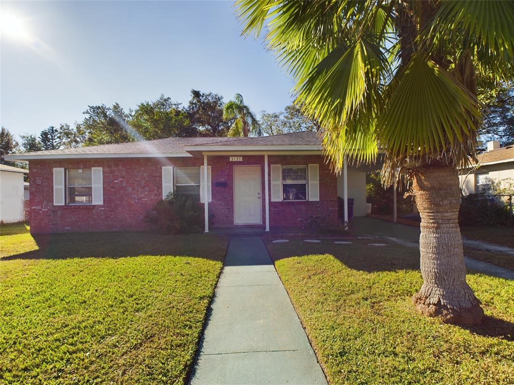 a front view of a house with a yard