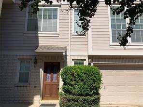 a view of a house with a window and a tree