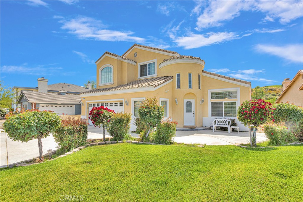 front view of a house with a garden