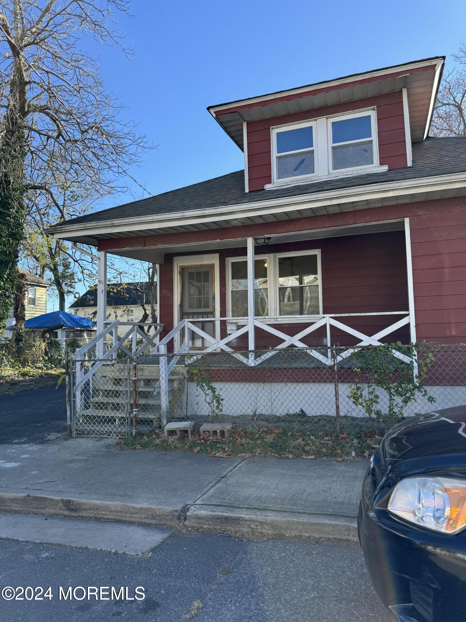 a front view of a house with porch