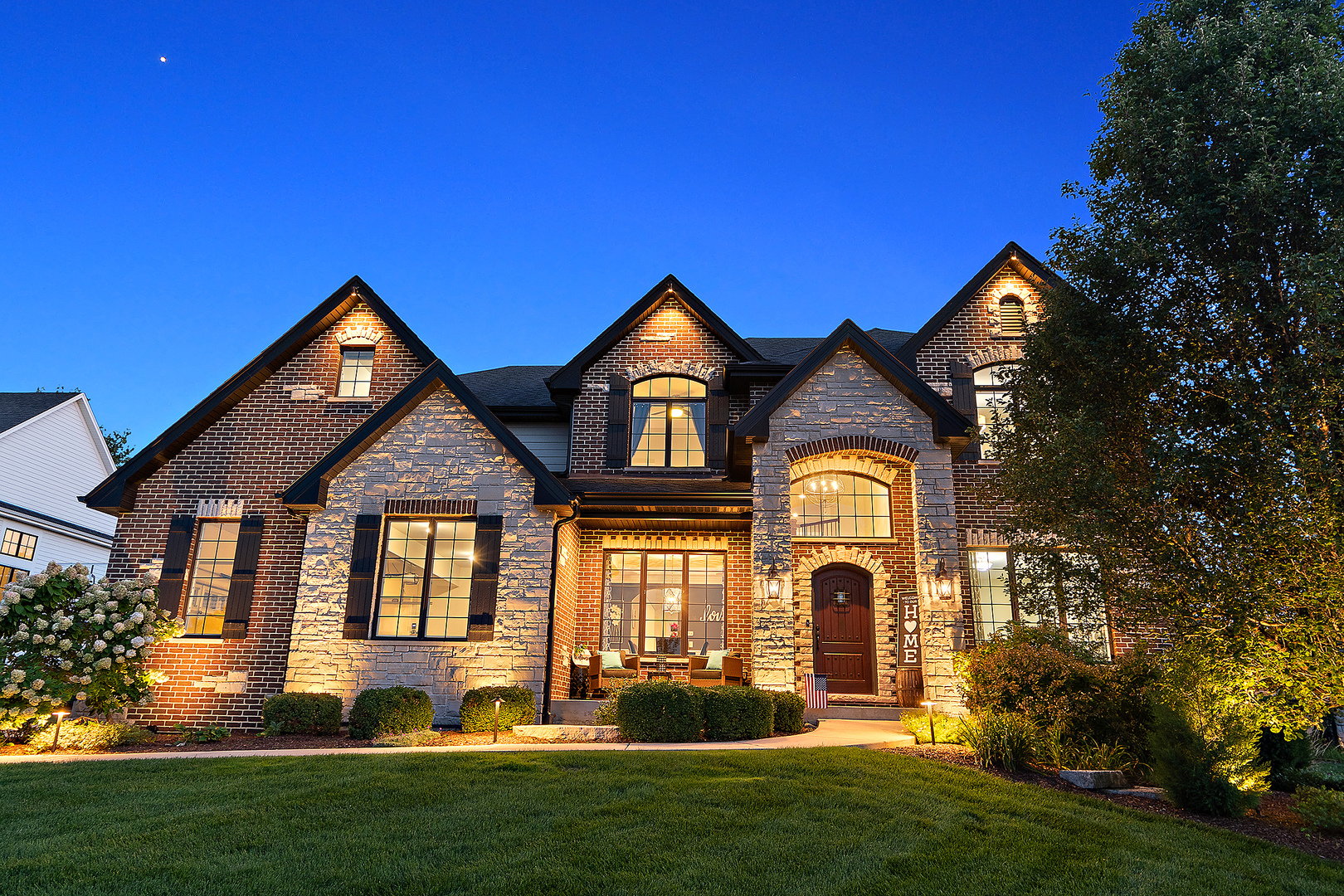 a front view of a house with a yard