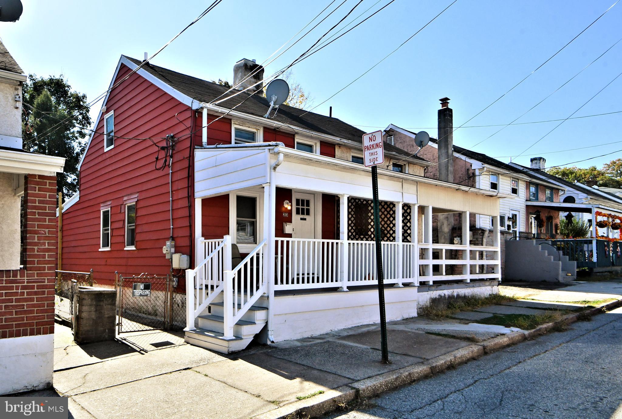 a front view of a house with street