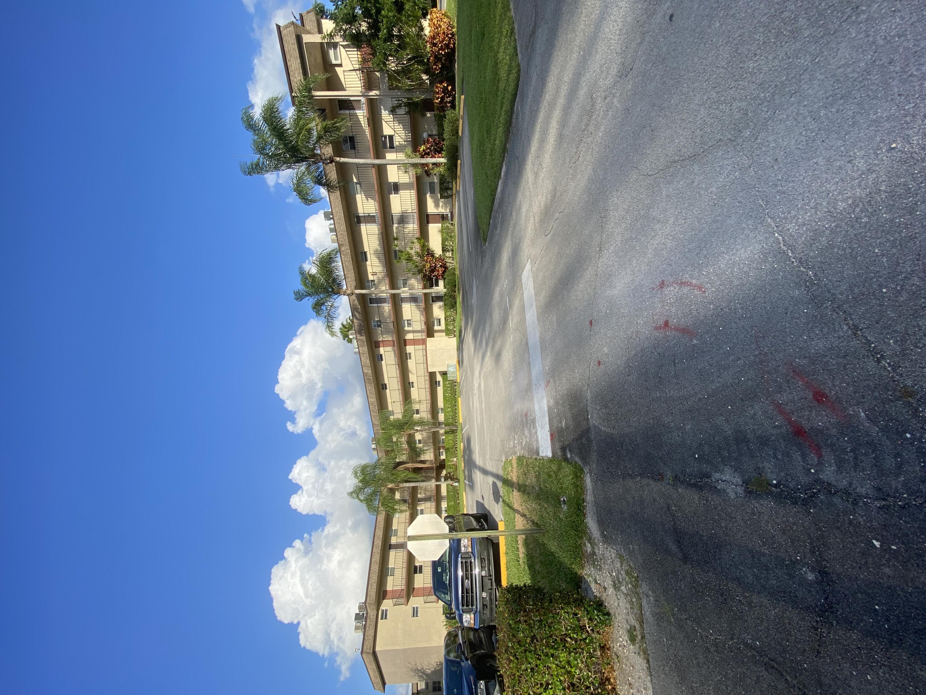 a view of a street with a building in the background