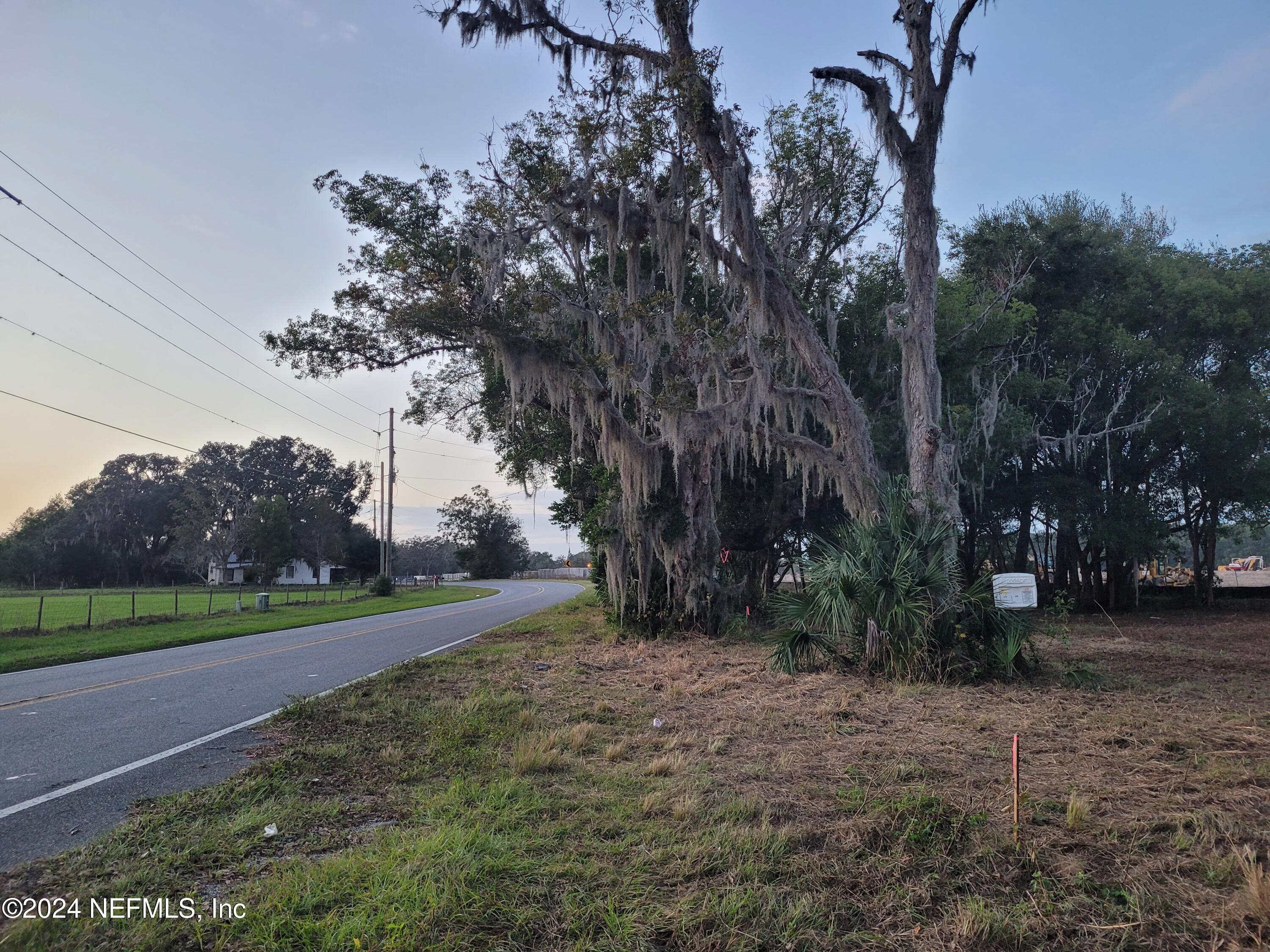 a view of a road with a yard