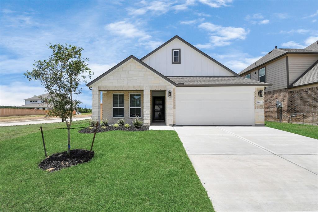 front view of a house with a yard