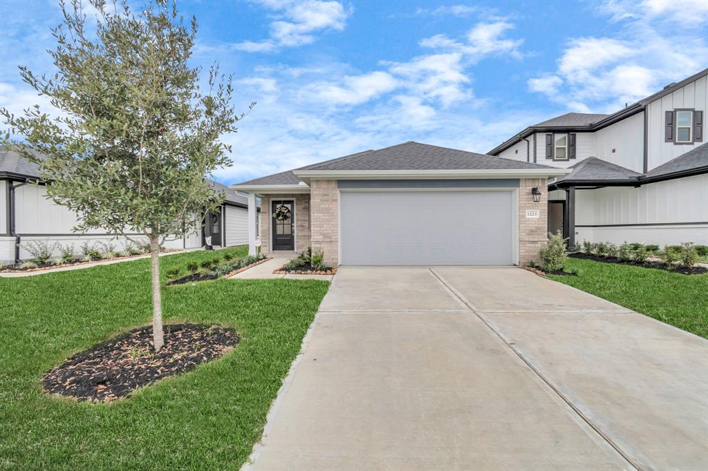 a front view of a house with a yard