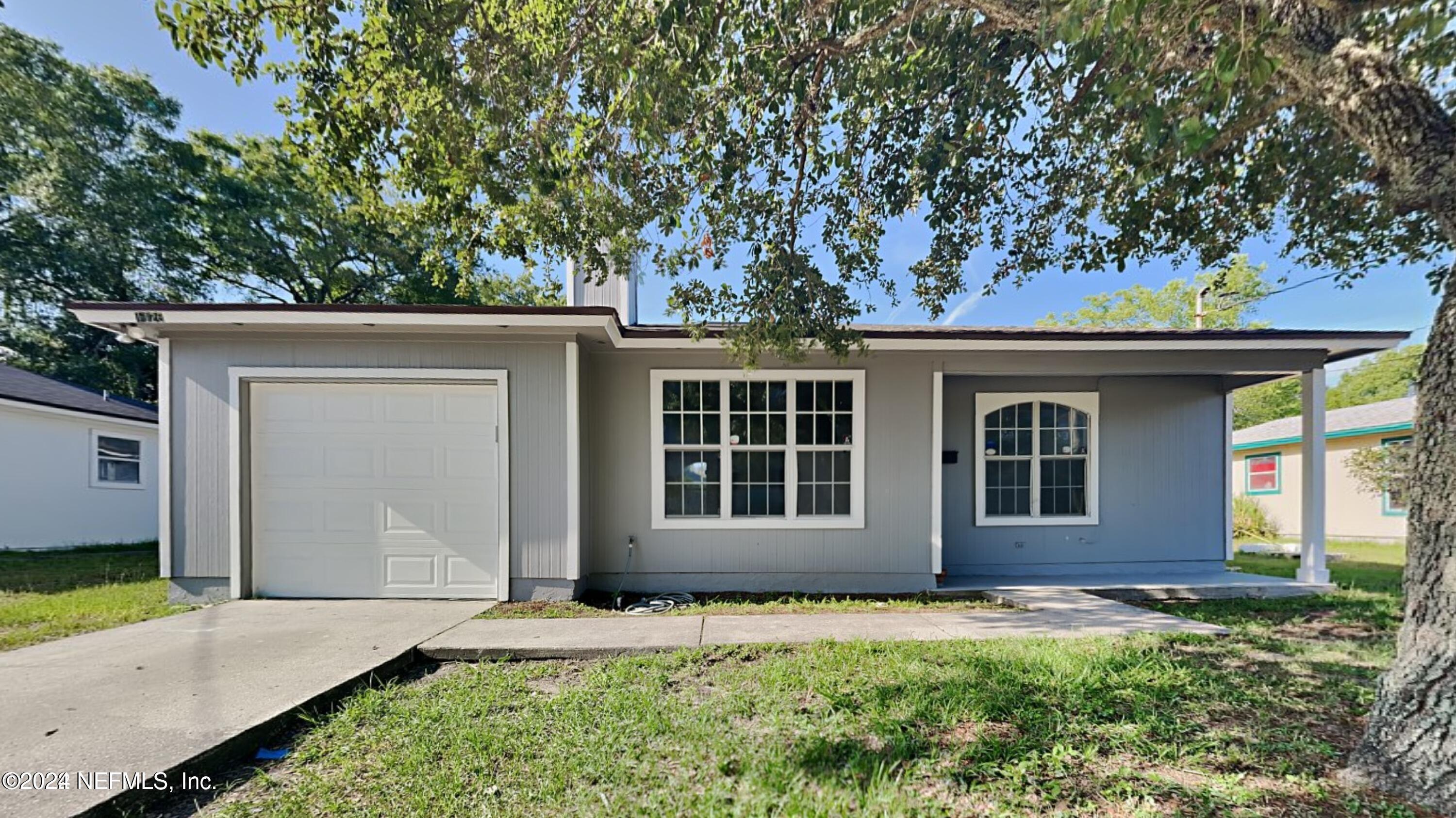 front view of a house with a yard