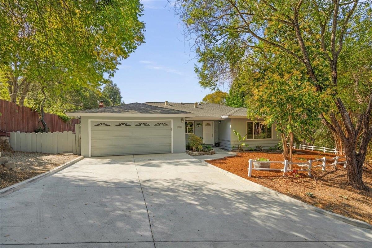 a view of house with yard and entertaining space