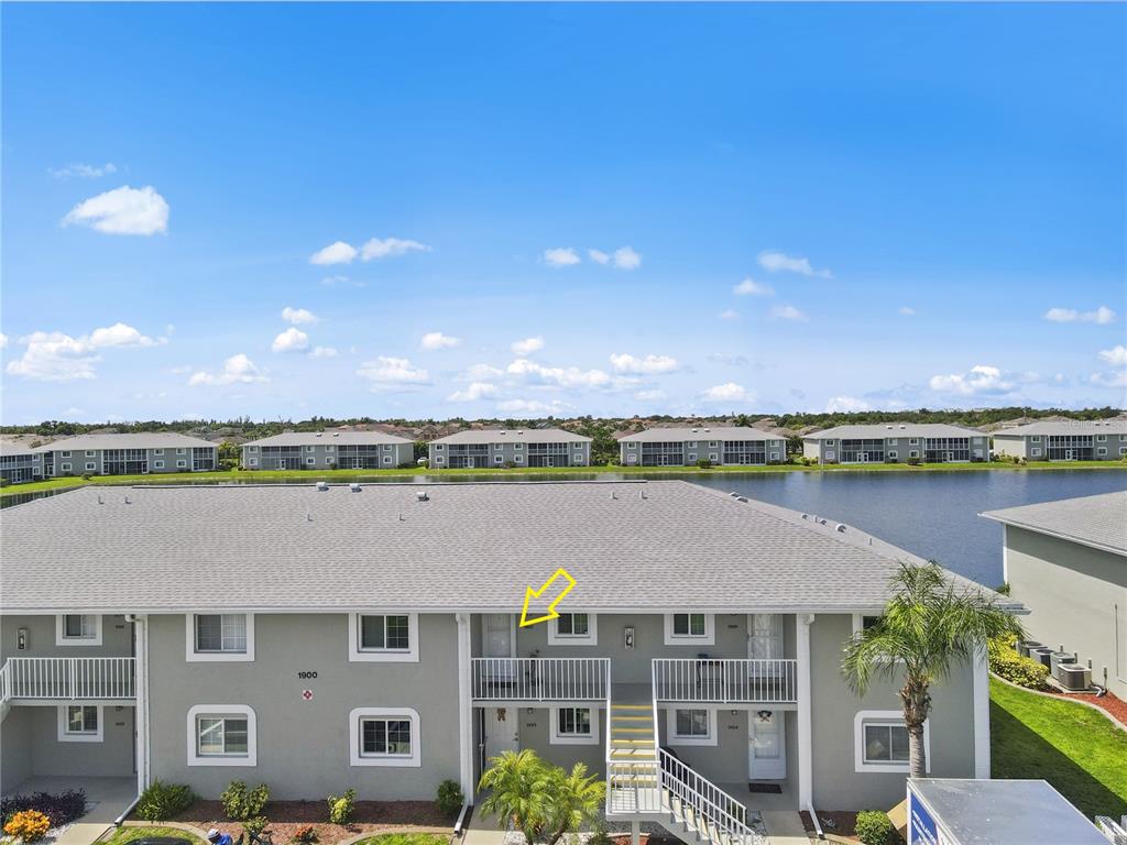 a aerial view of a house with a lake view