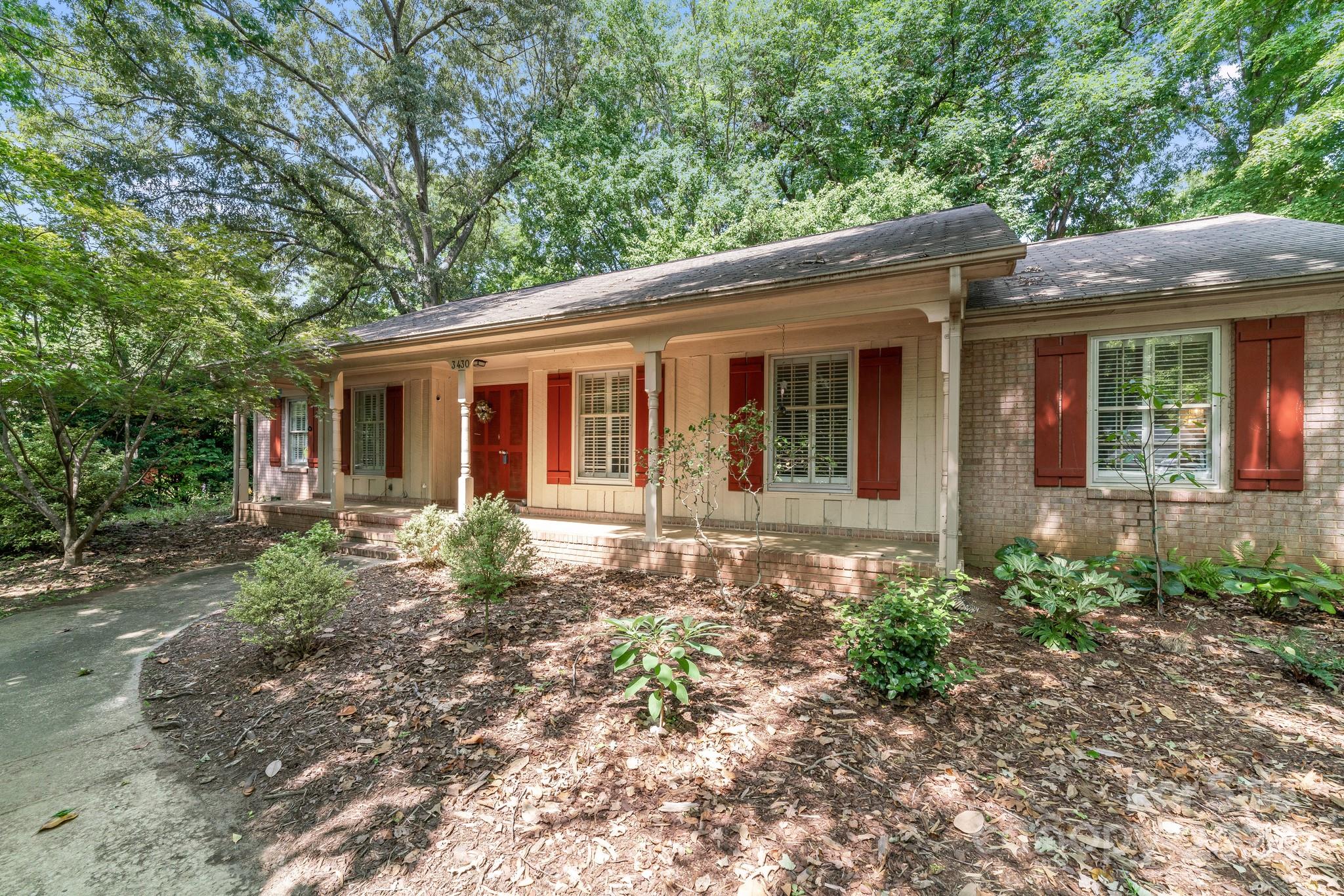 front view of a house with a garden