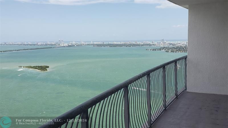 a view of a lake from a balcony