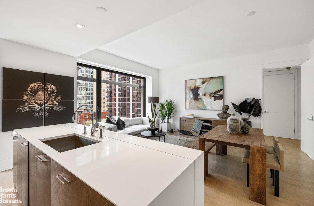 a very nice looking dining room with a large window