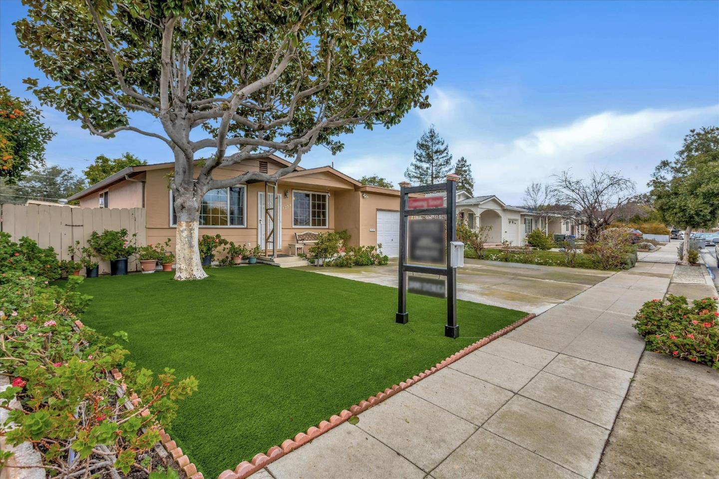 a front view of a house with garden