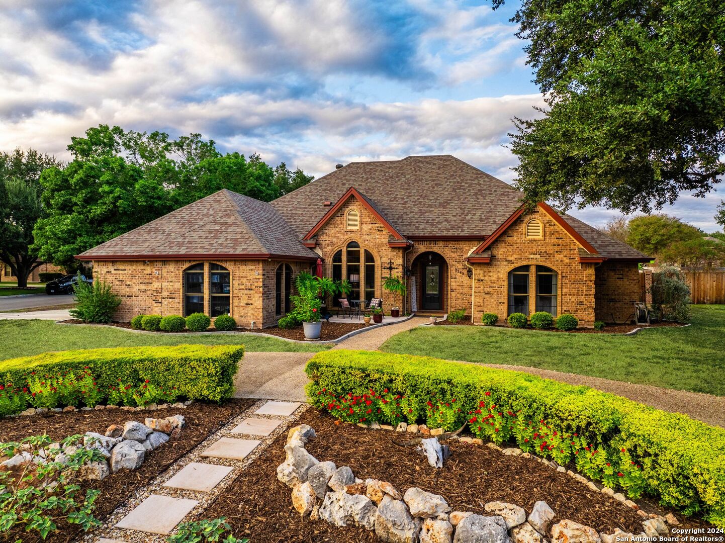 a front view of a house with a yard