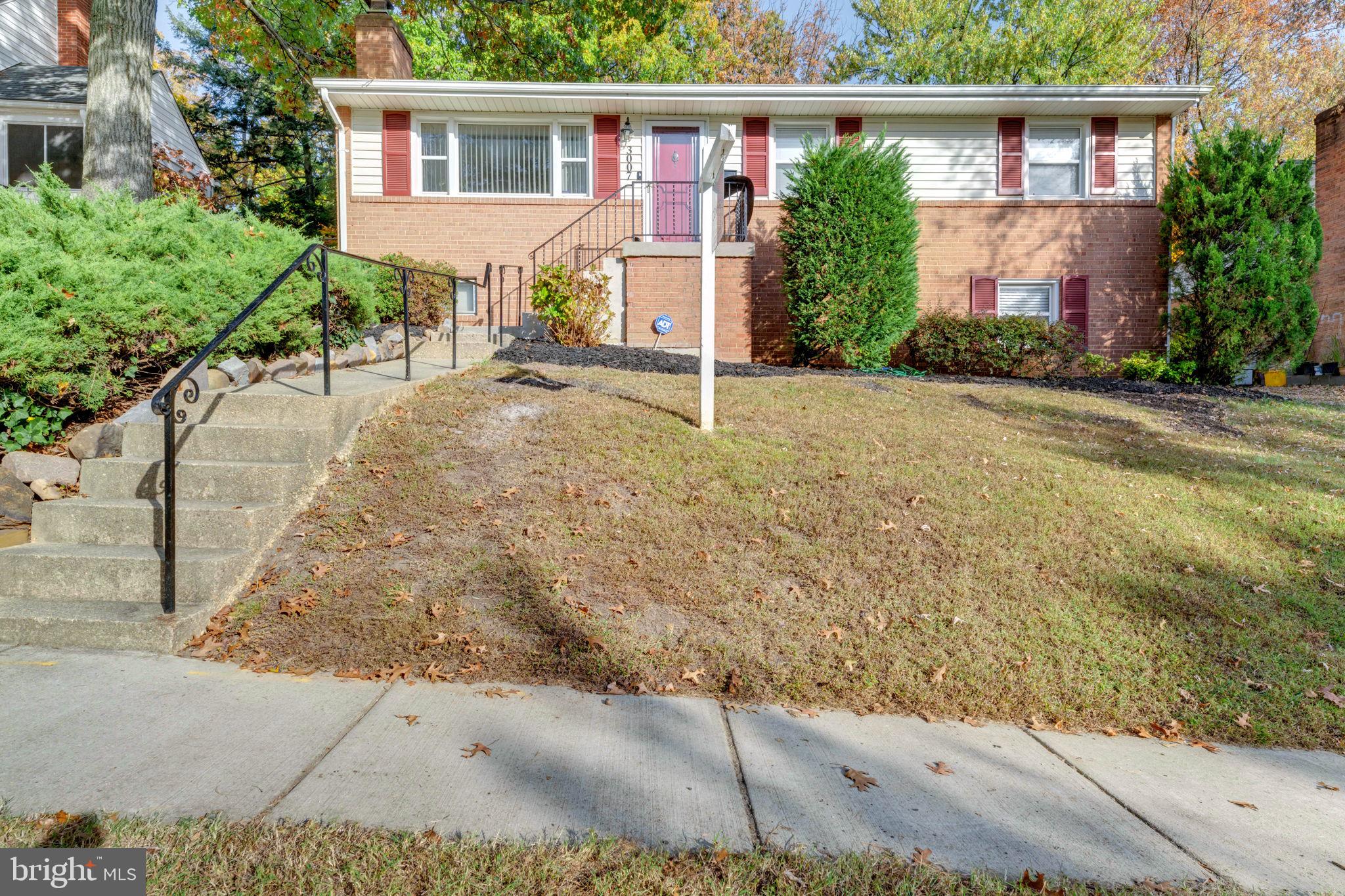 front view of a house with a yard