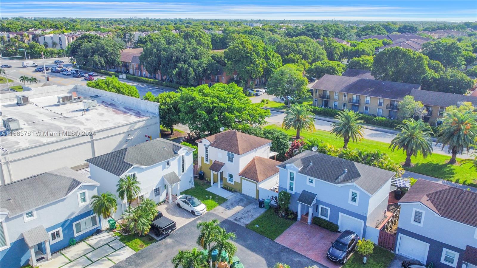 an aerial view of residential house with outdoor space and swimming pool