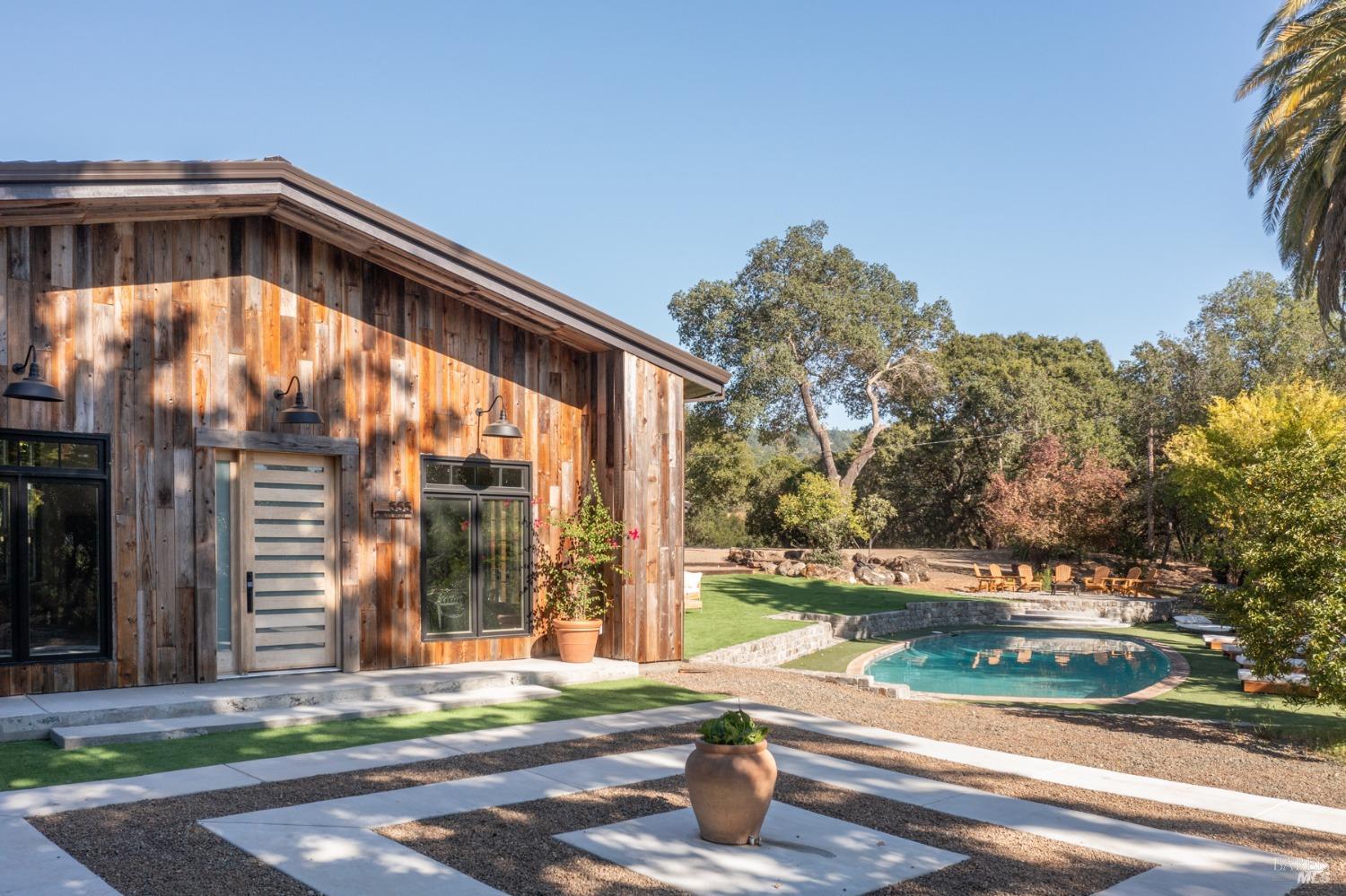 a backyard of a house with lots of green space