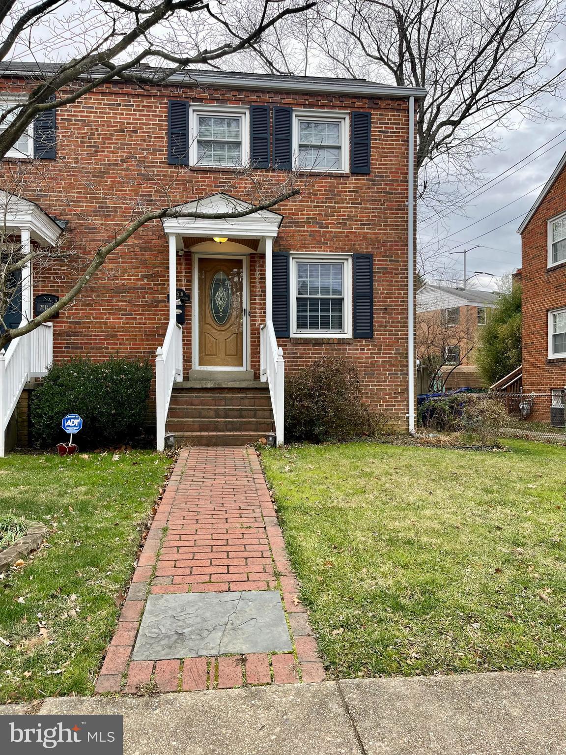 Brick walkway welcomes you to this lovely duplex