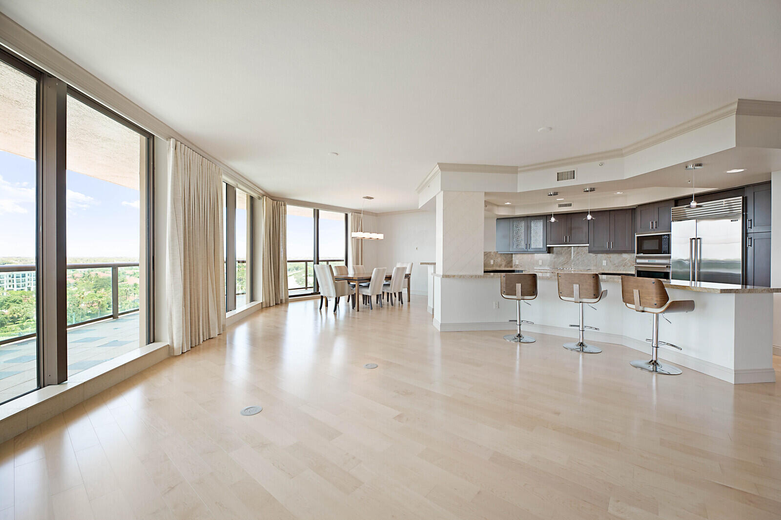 a view of kitchen with dining table and chairs