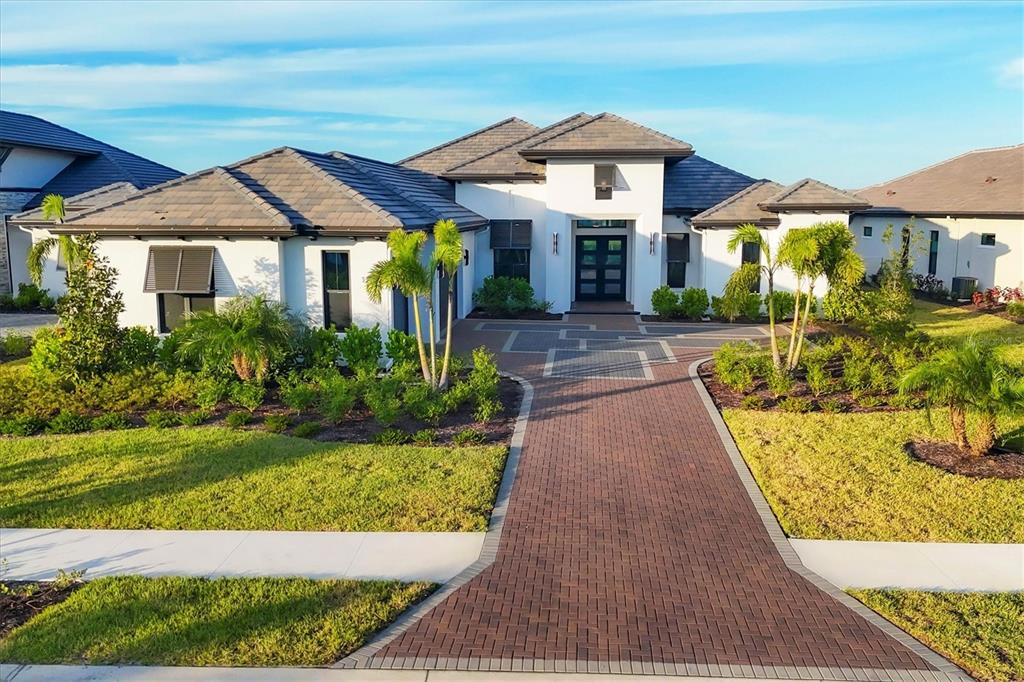 a front view of a house with a yard