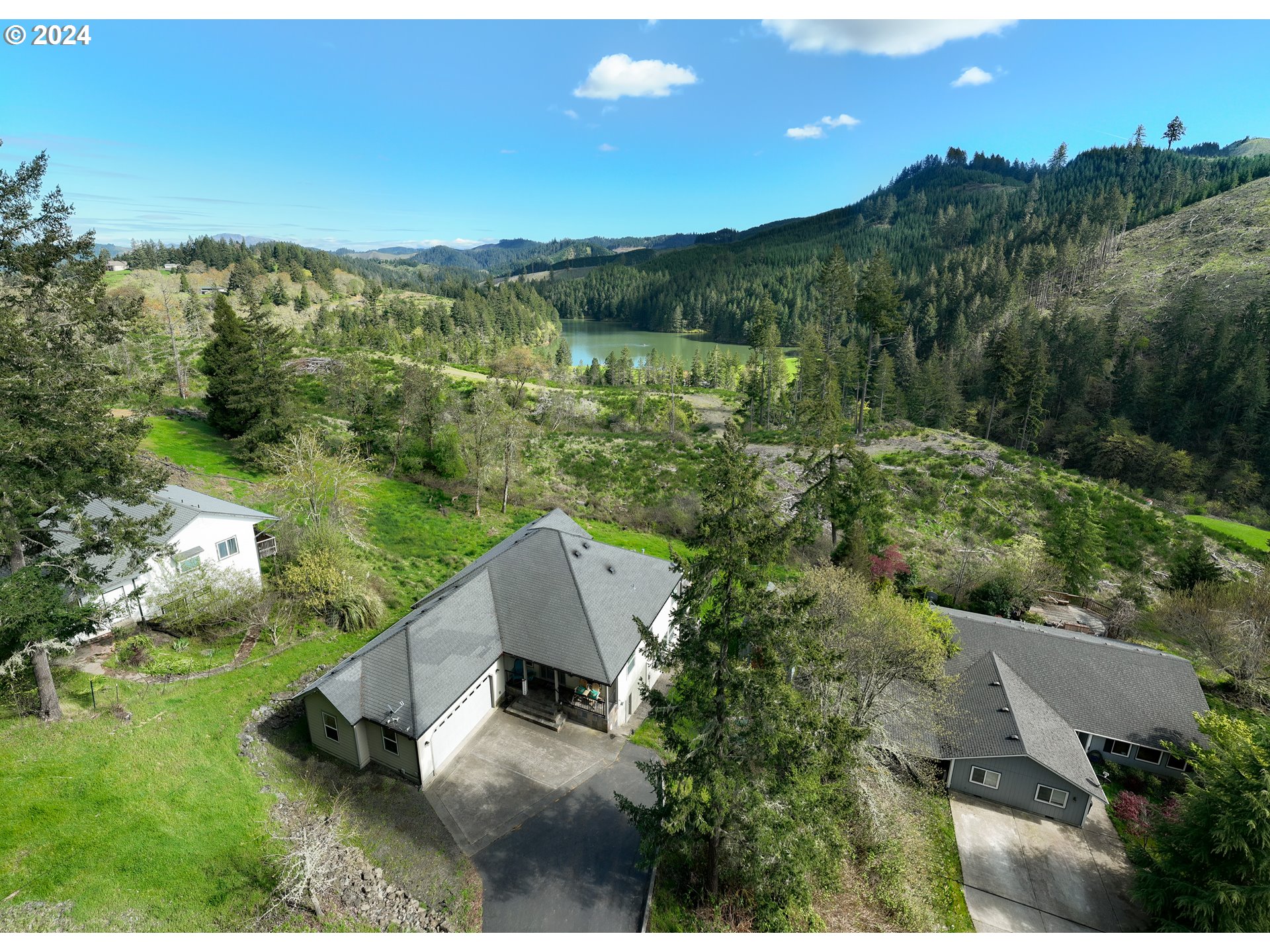 an aerial view of a house with mountain view