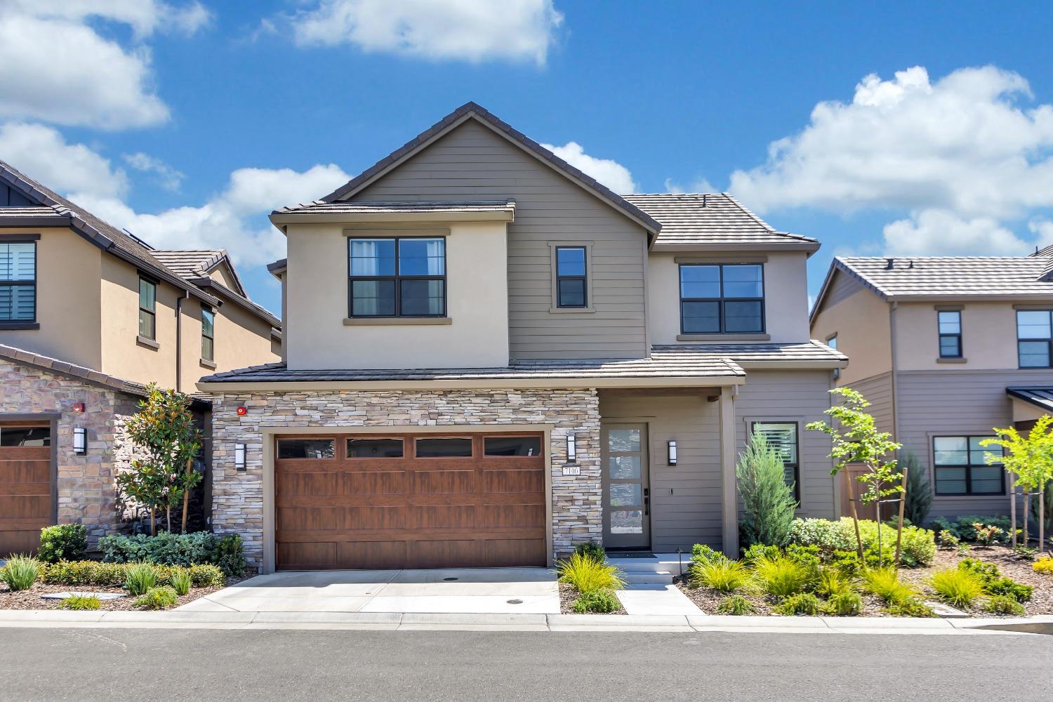 a front view of a house with a garage