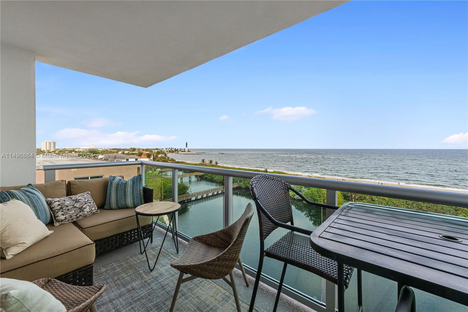 a balcony with table and chairs