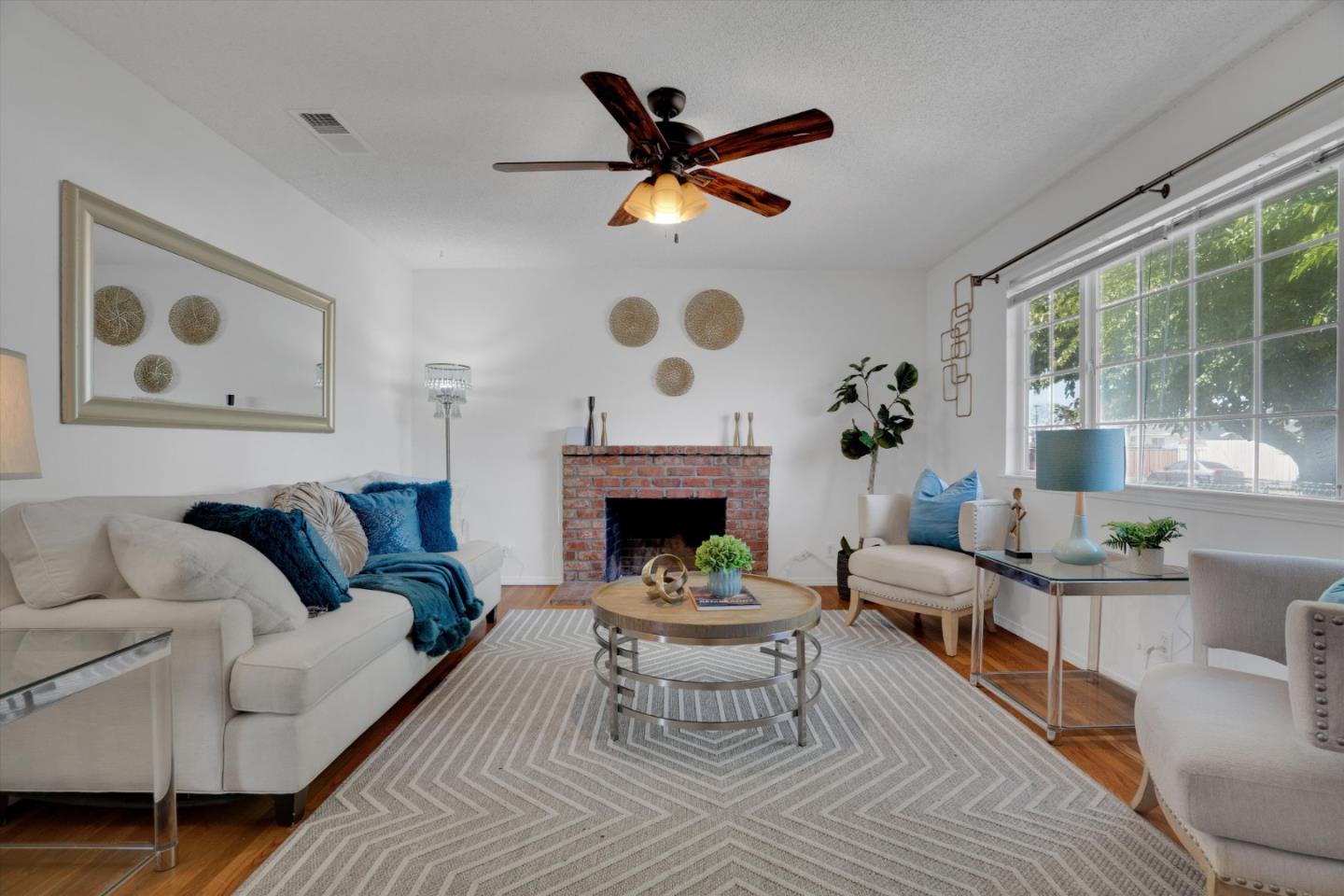 a living room with furniture and a fireplace