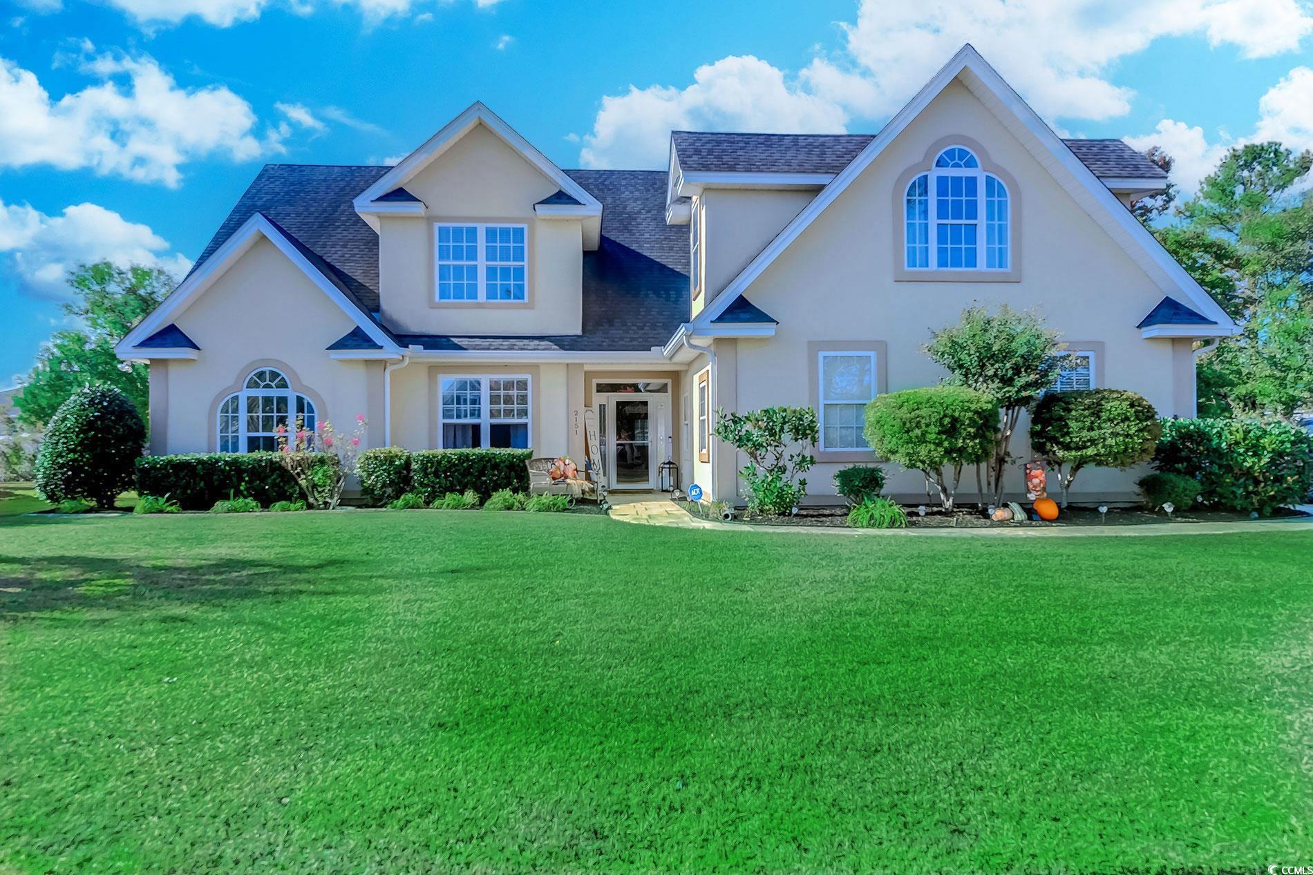 View of front of property with a front yard