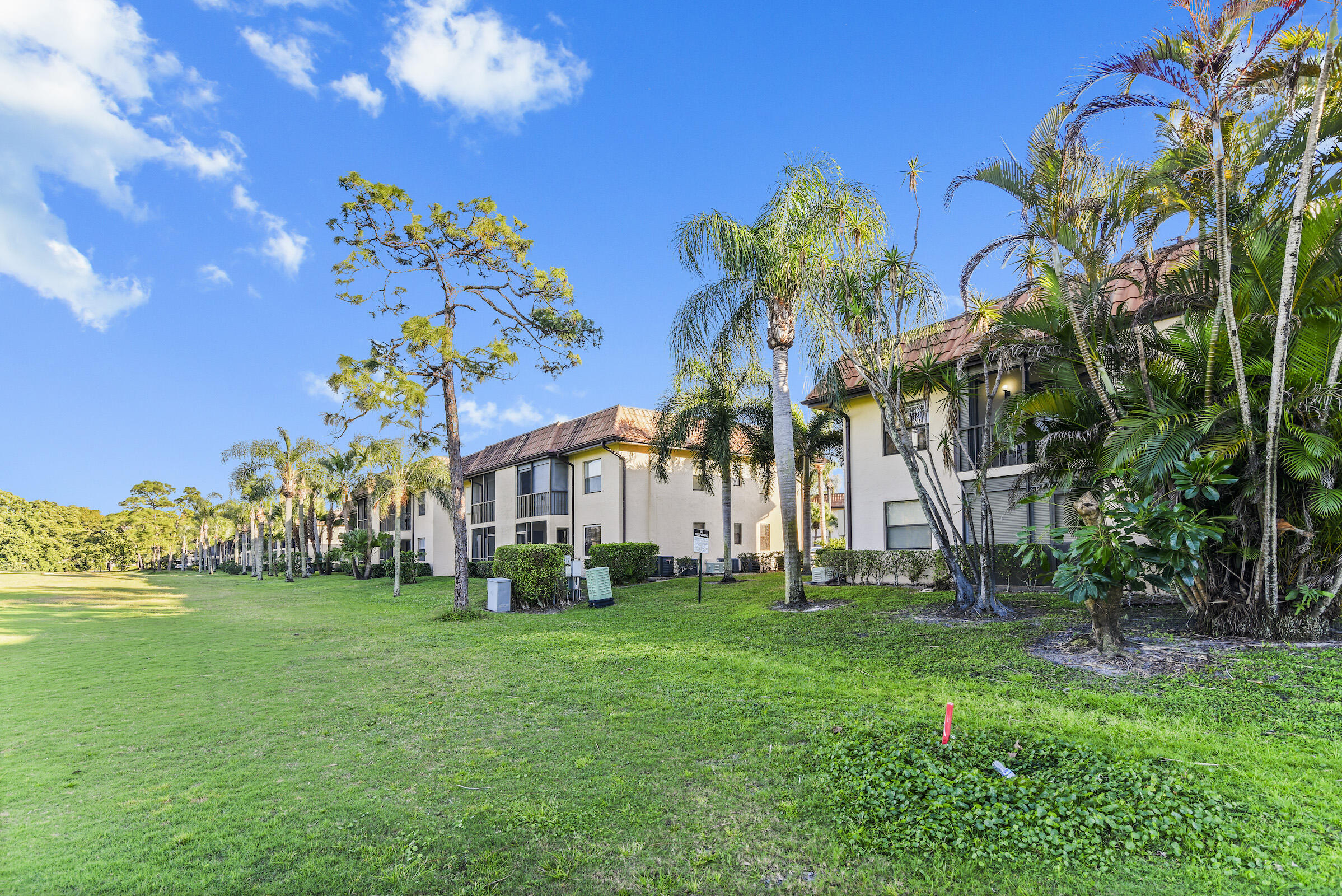 a front view of a house with a big yard