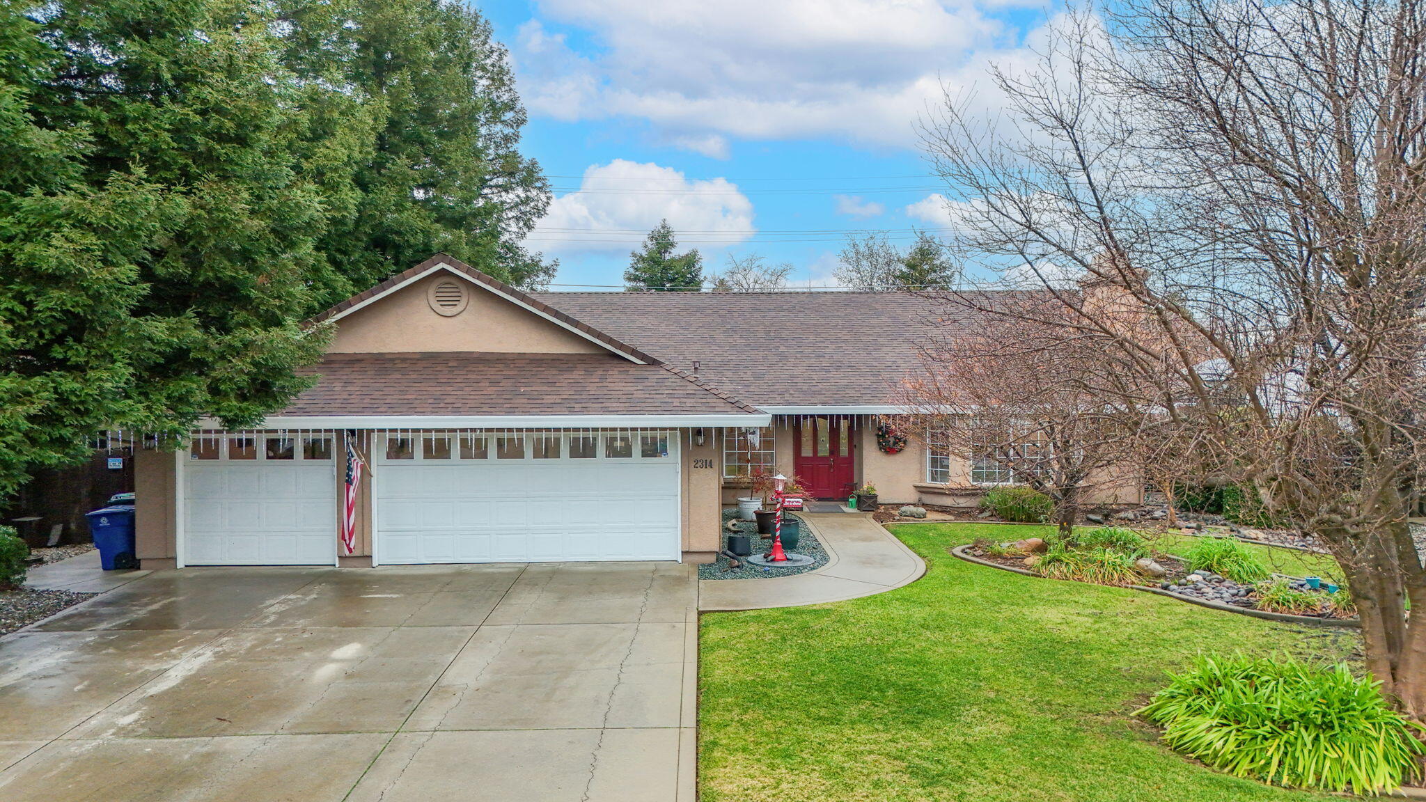 a front view of house with yard and green space