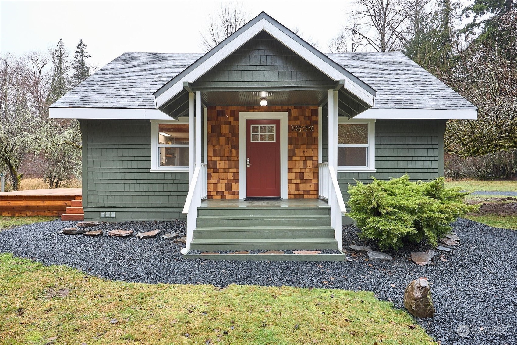 a front view of a house with garden