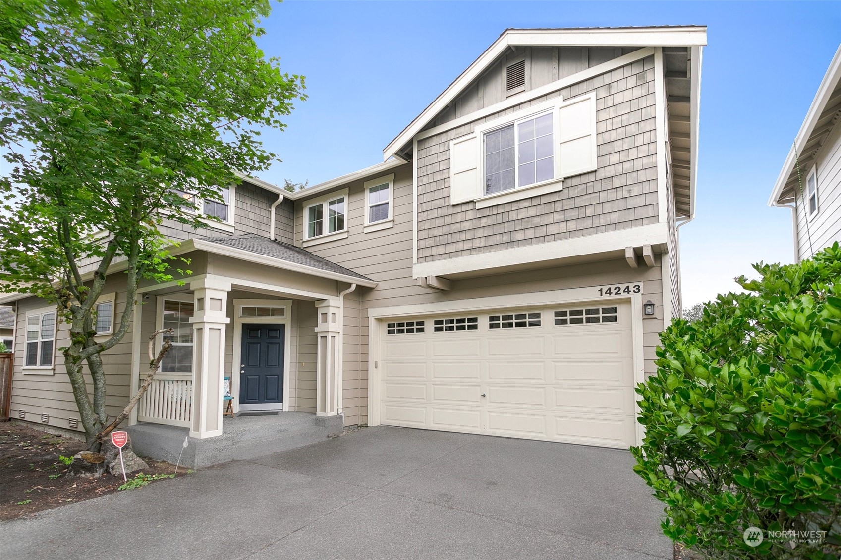 a front view of a house with a garage