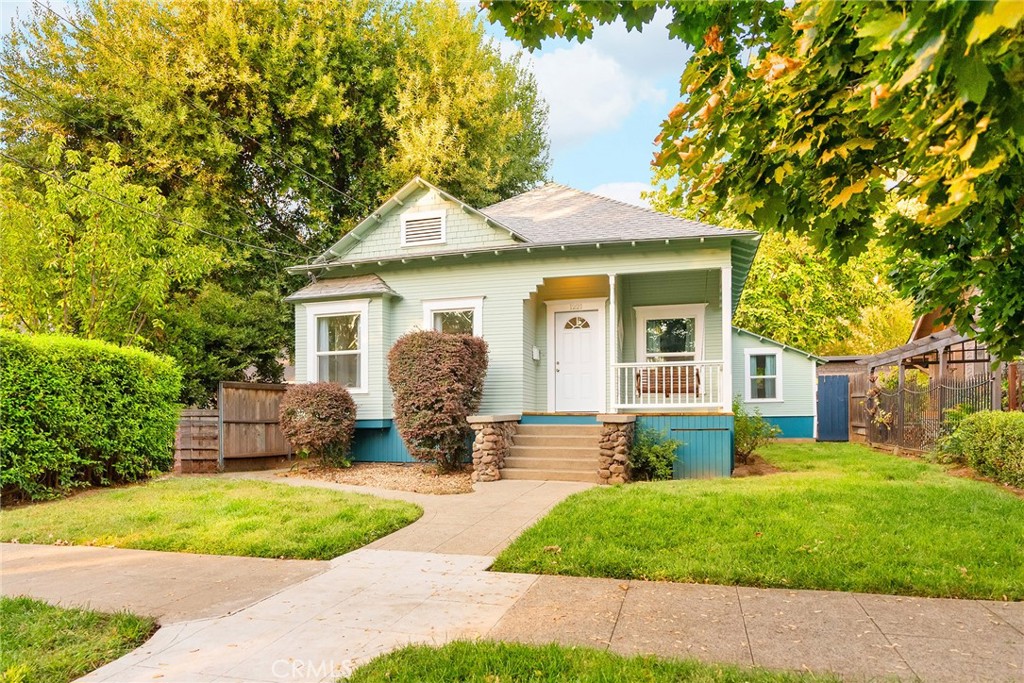 a front view of house with yard and green space