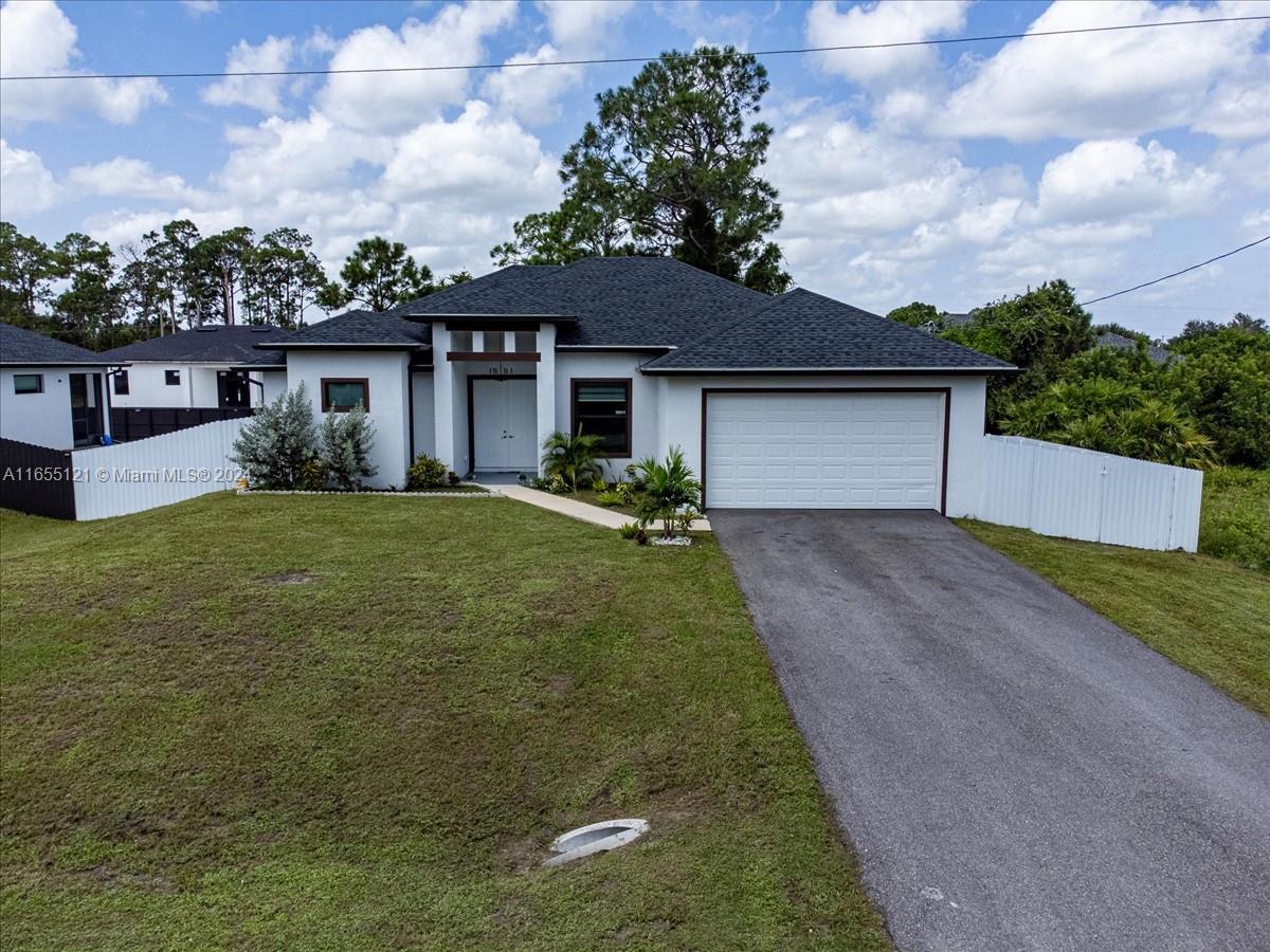 front view of a house with a yard