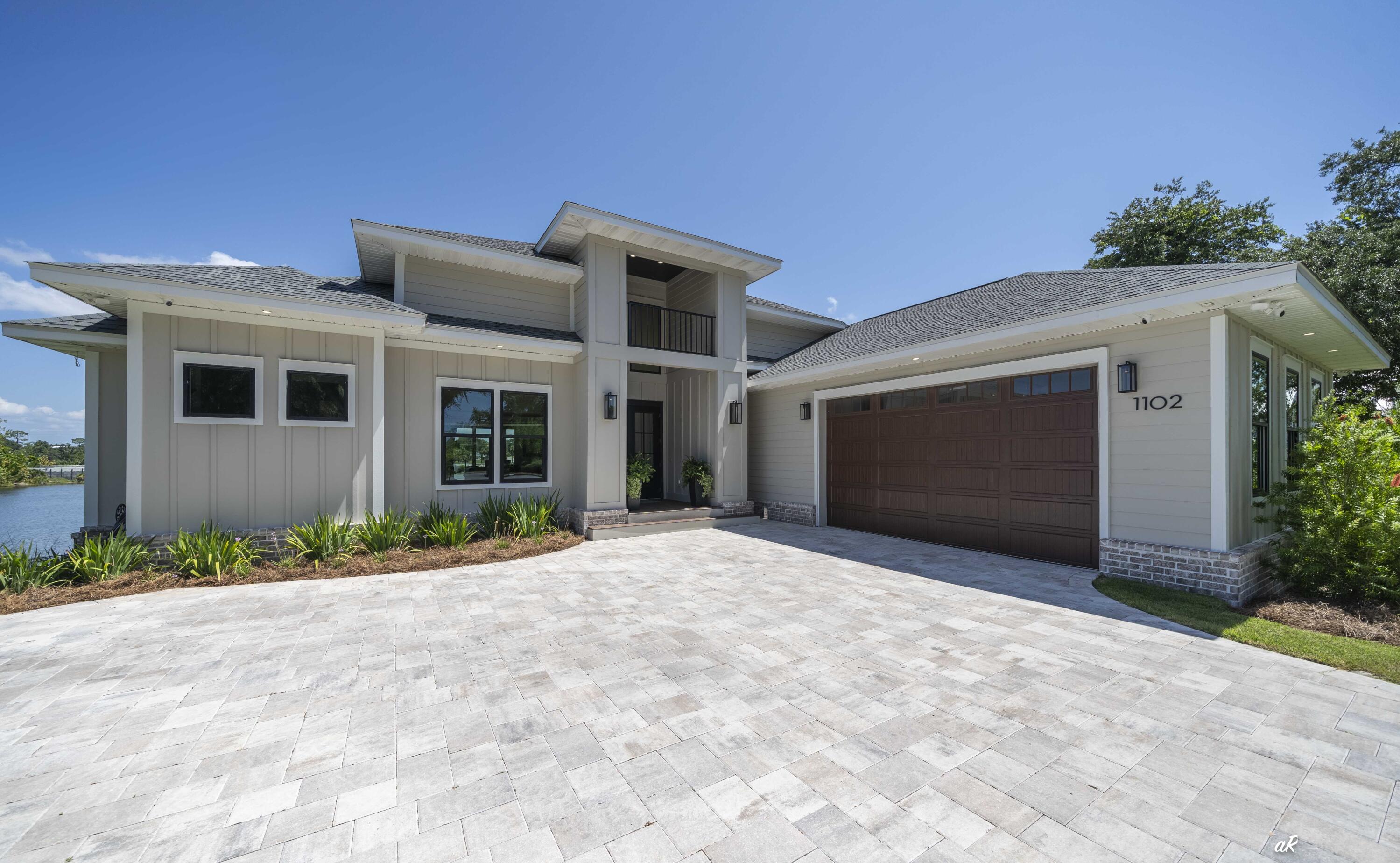 a front view of a house with a garage