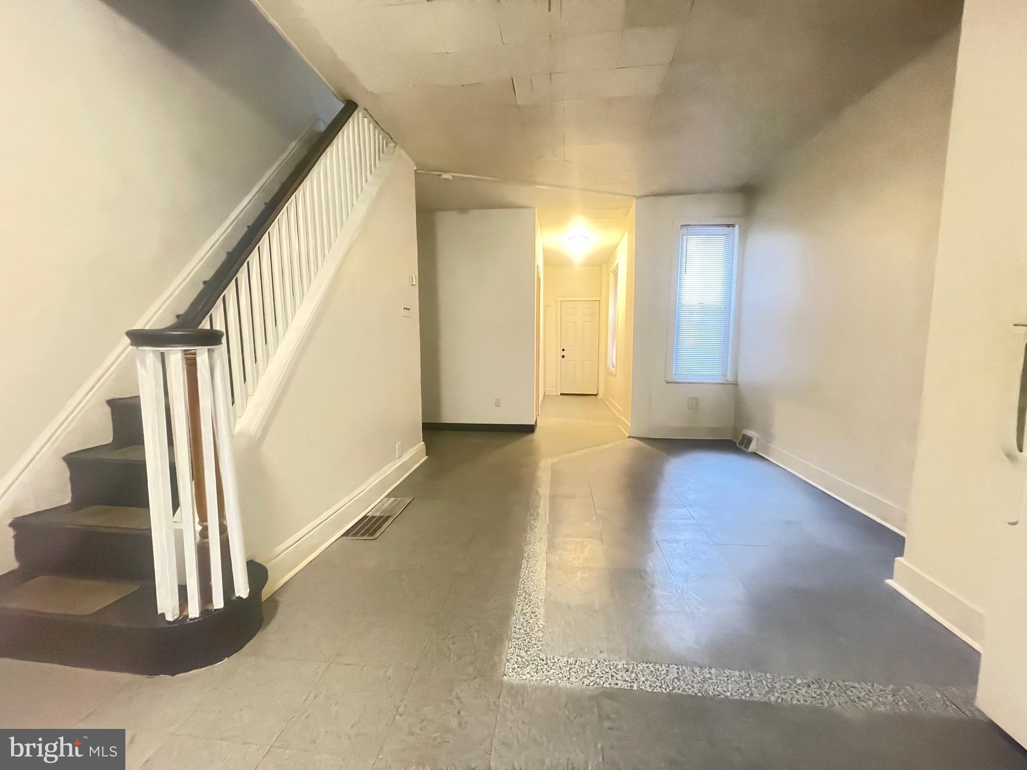 a view of an entryway with wooden floor