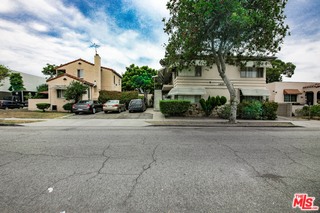 a view of a street in front of a house