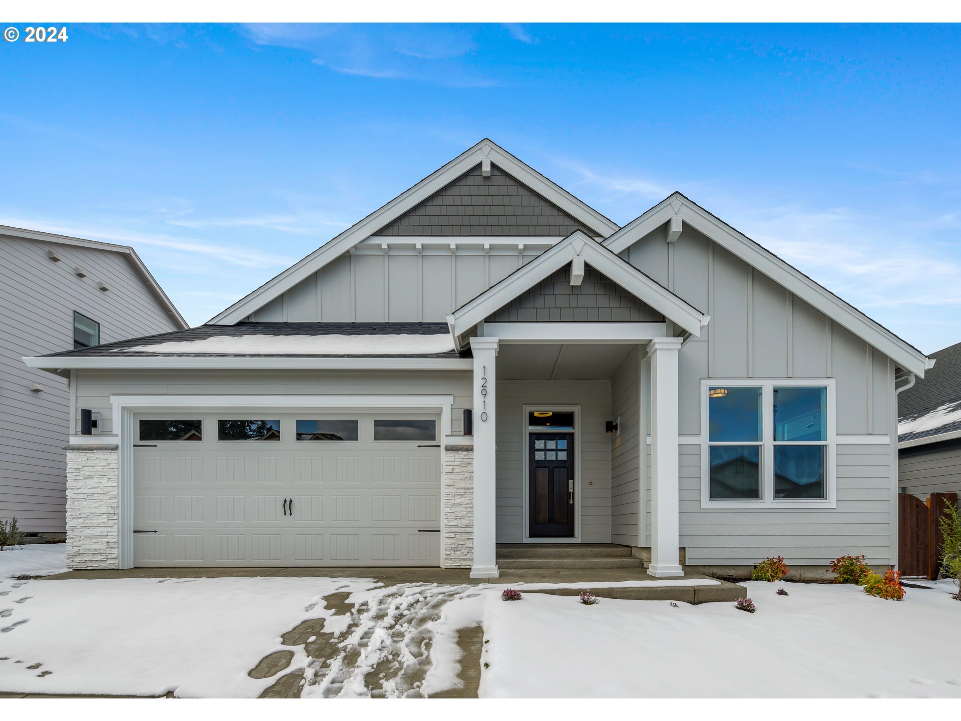 a front view of a house with a garage