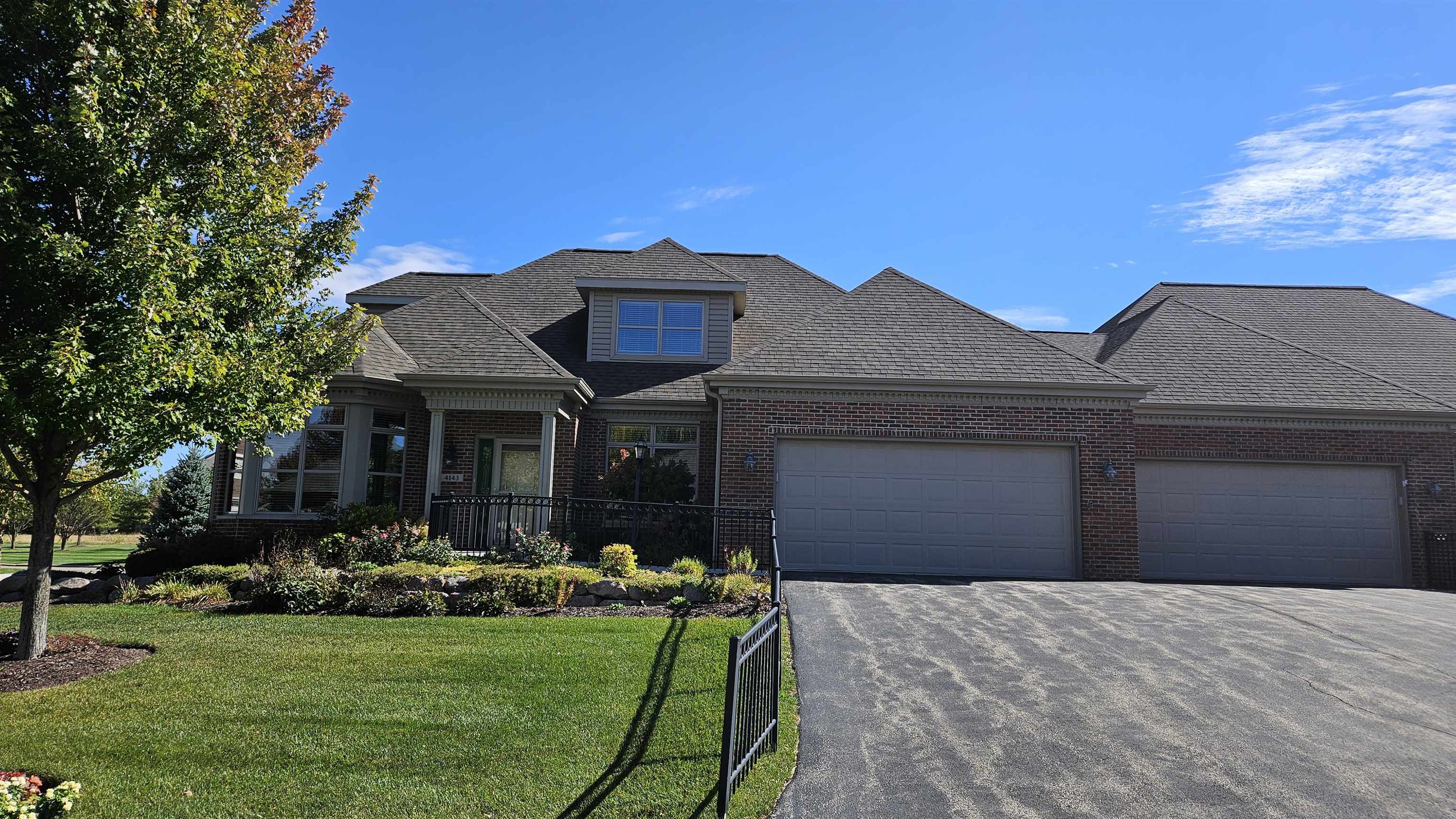 a front view of house with yard and outdoor seating