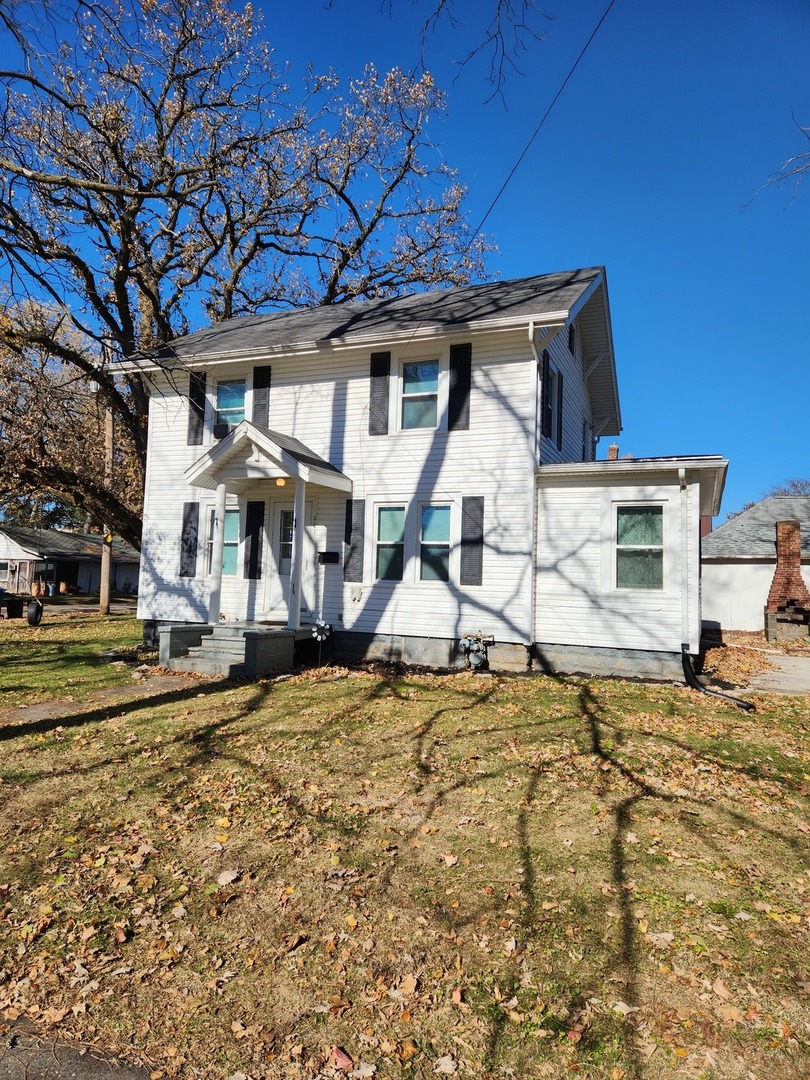 a house with trees in front of it