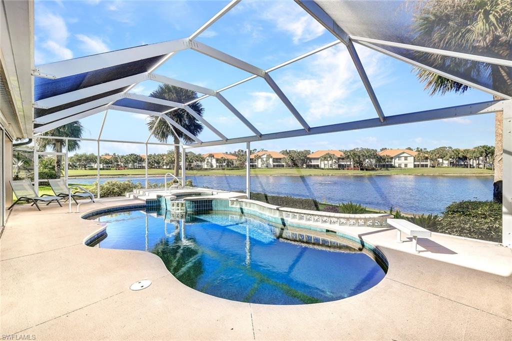 a view of a swimming pool with outdoor seating