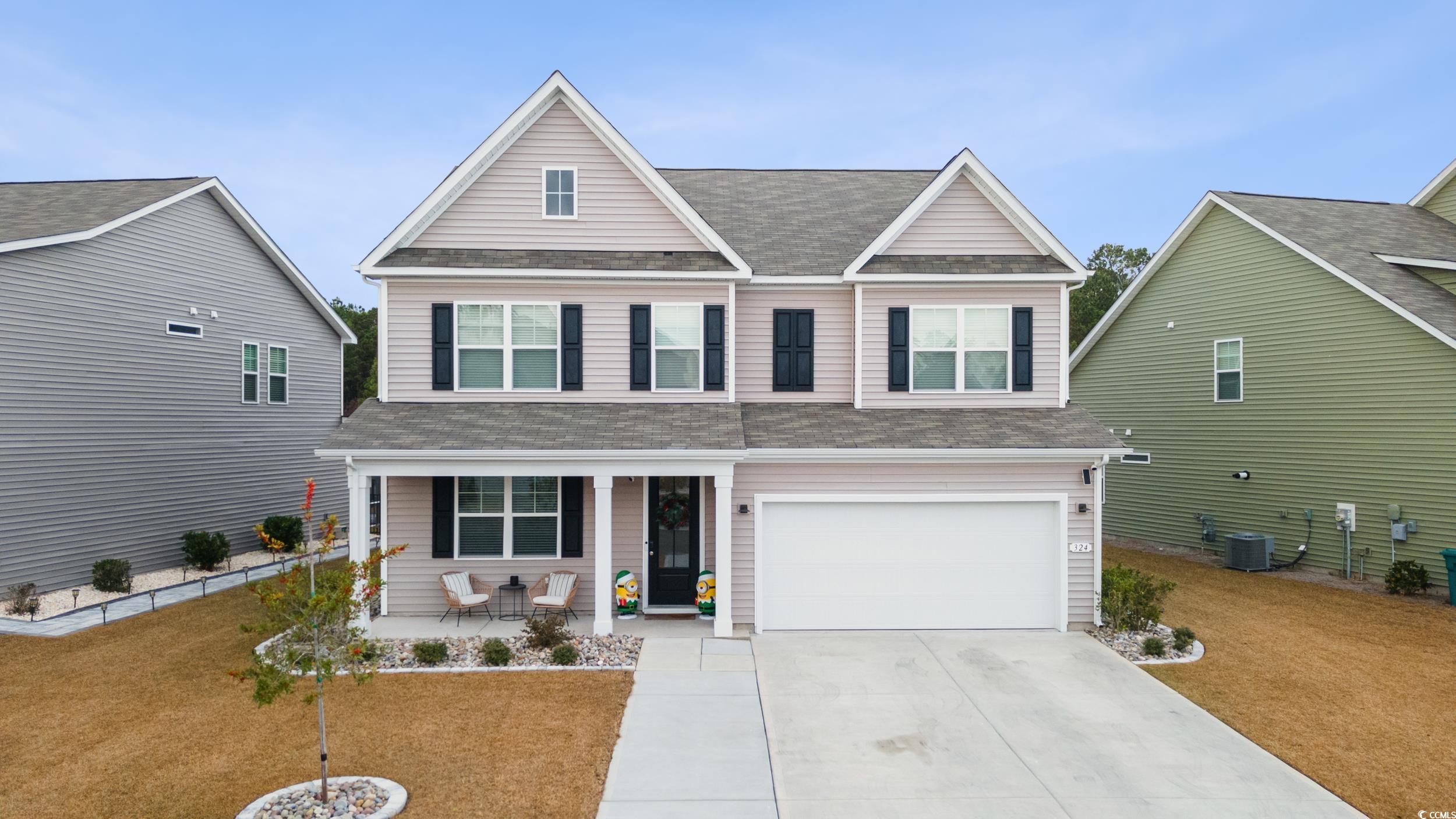 View of front of house featuring covered porch, ce