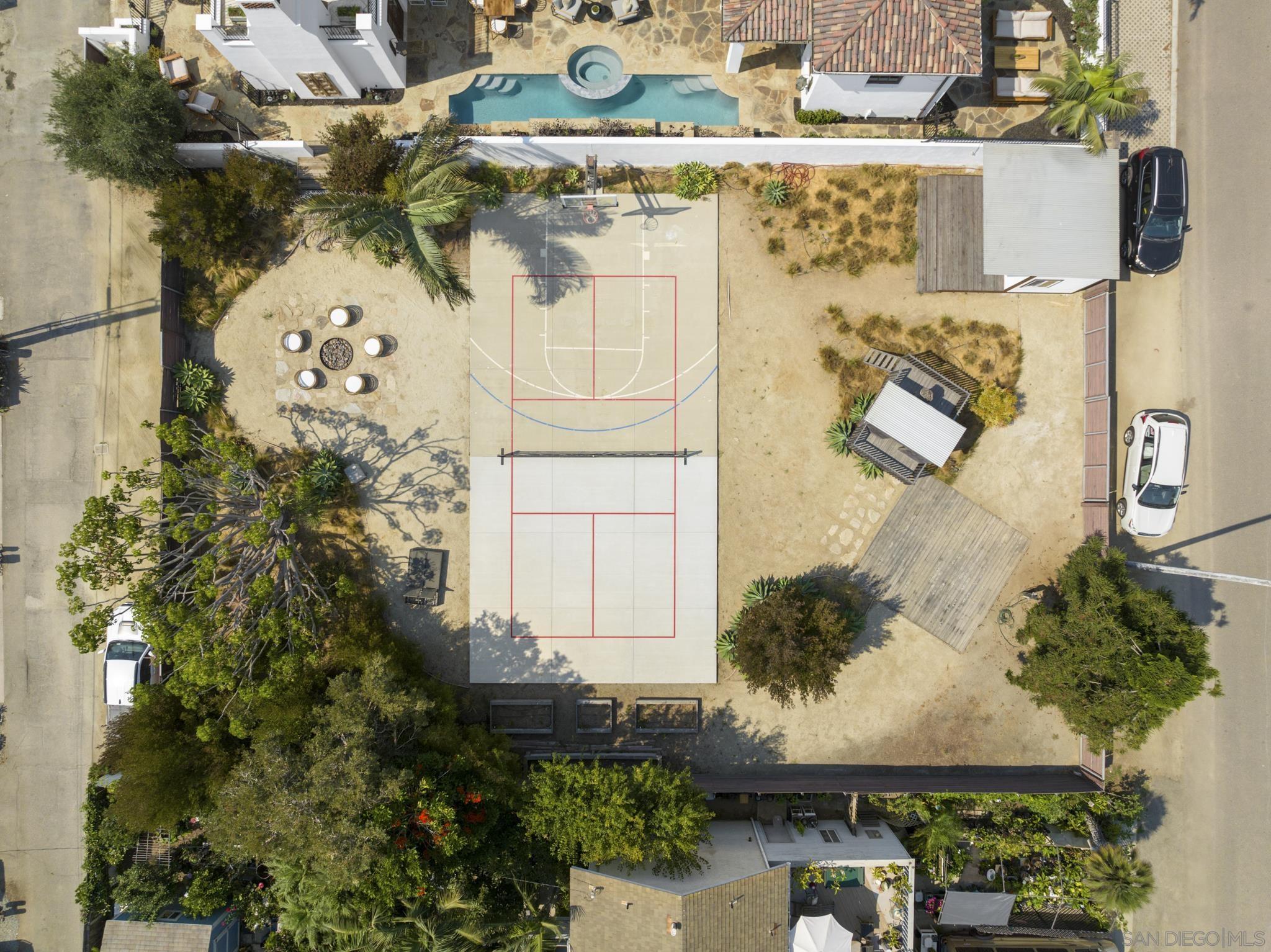 an aerial view of a house with a yard and garden