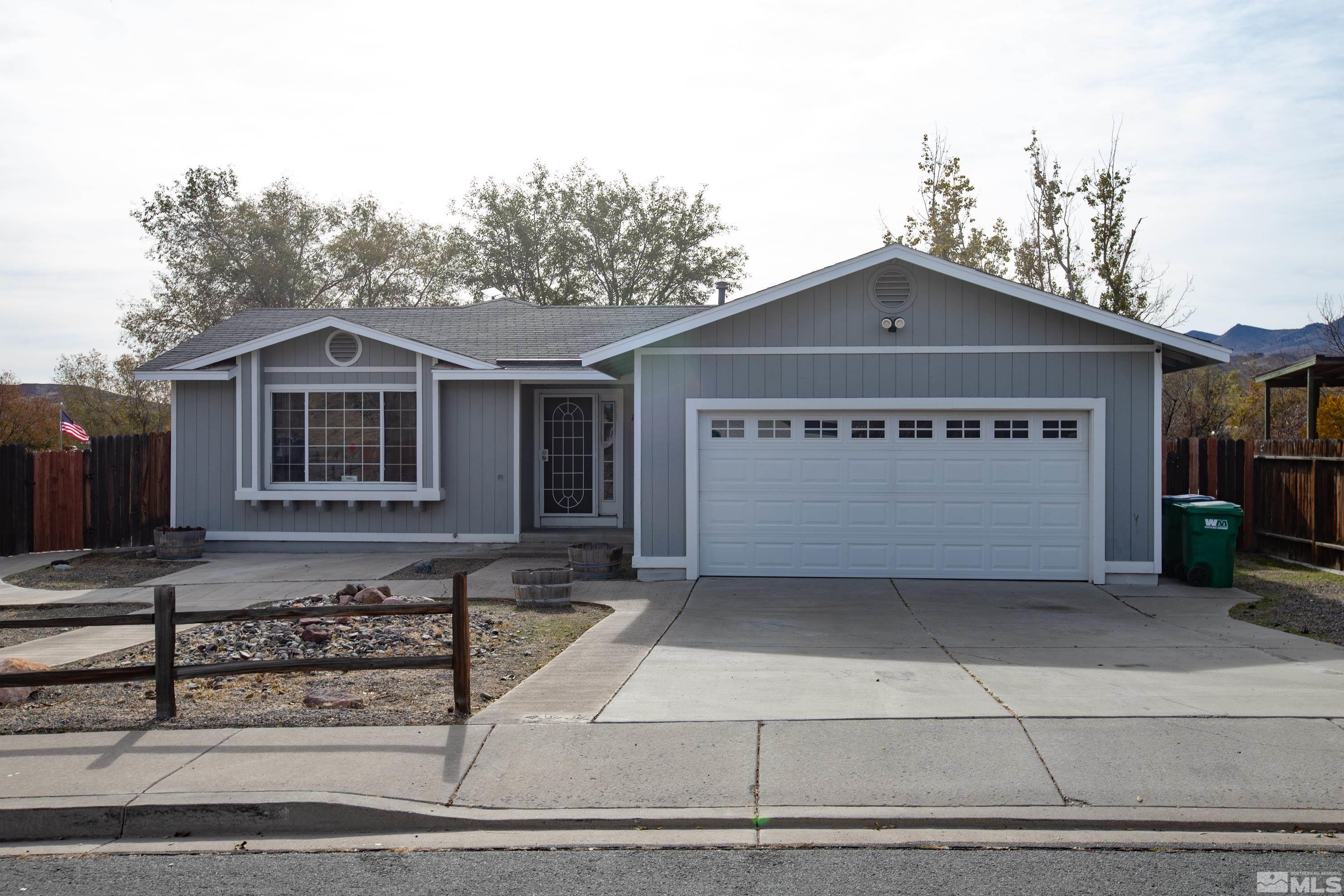 a front view of a house with a garage