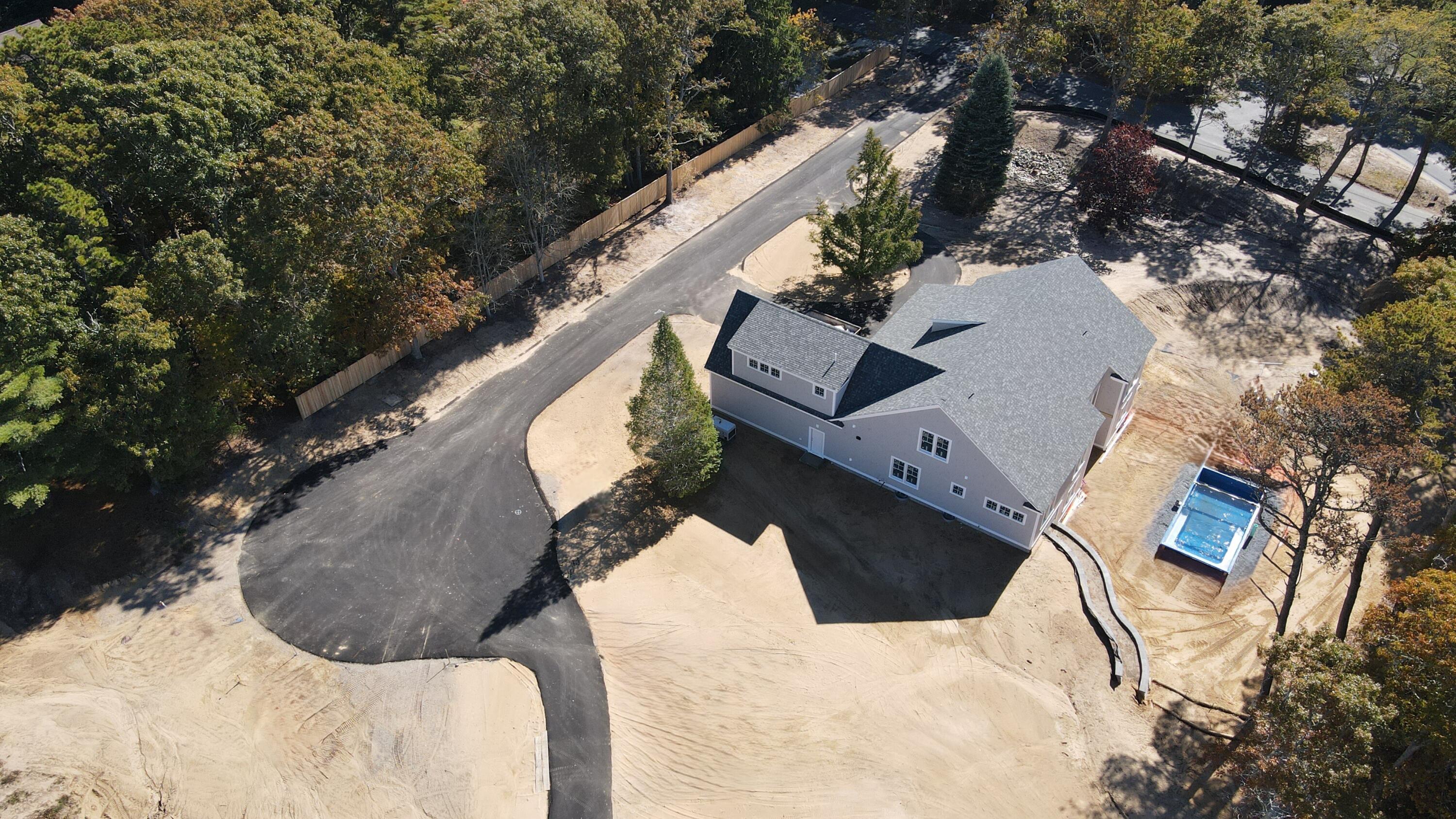 an aerial view of a house with outdoor space