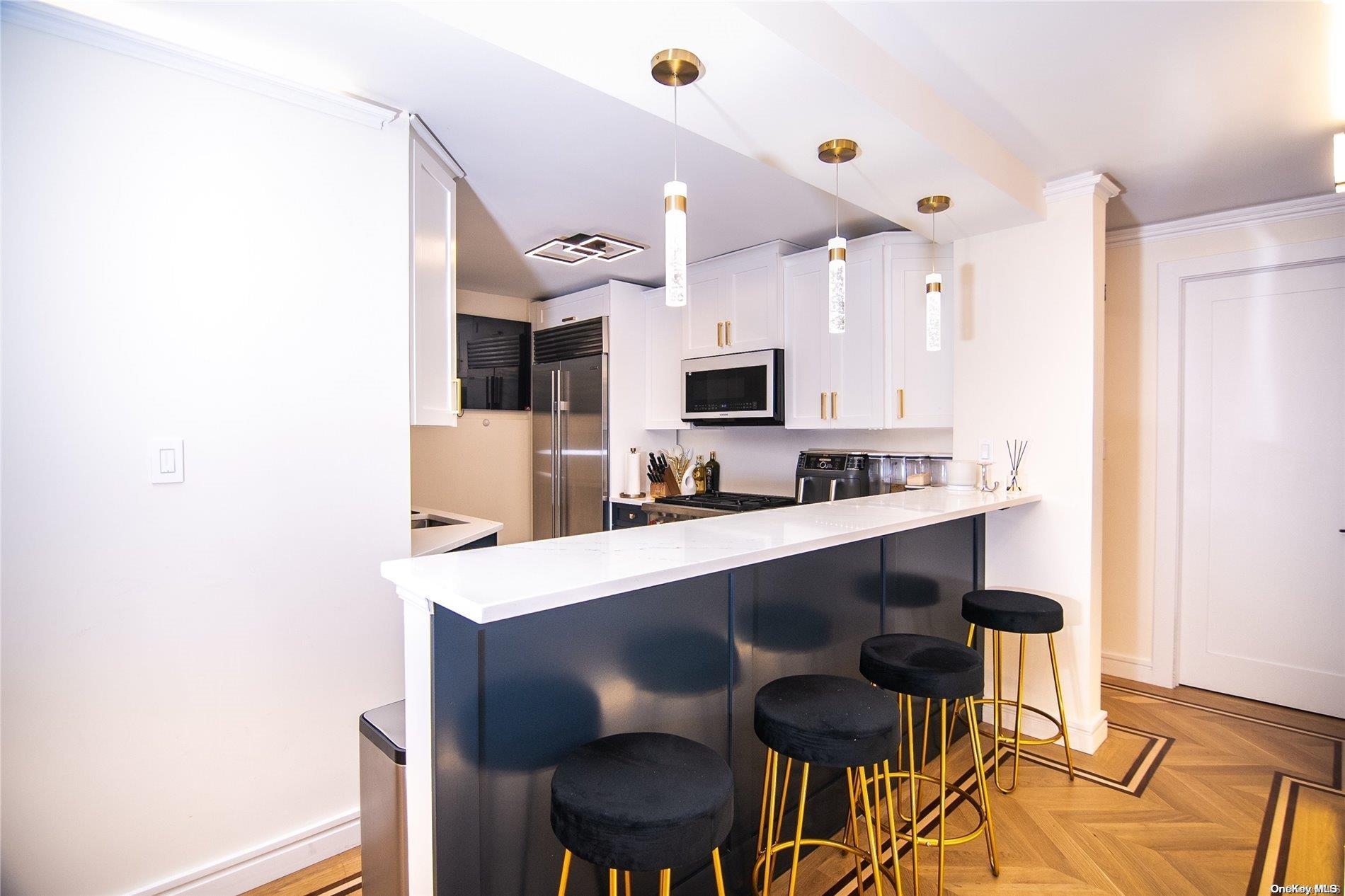 a kitchen with a sink cabinets and window