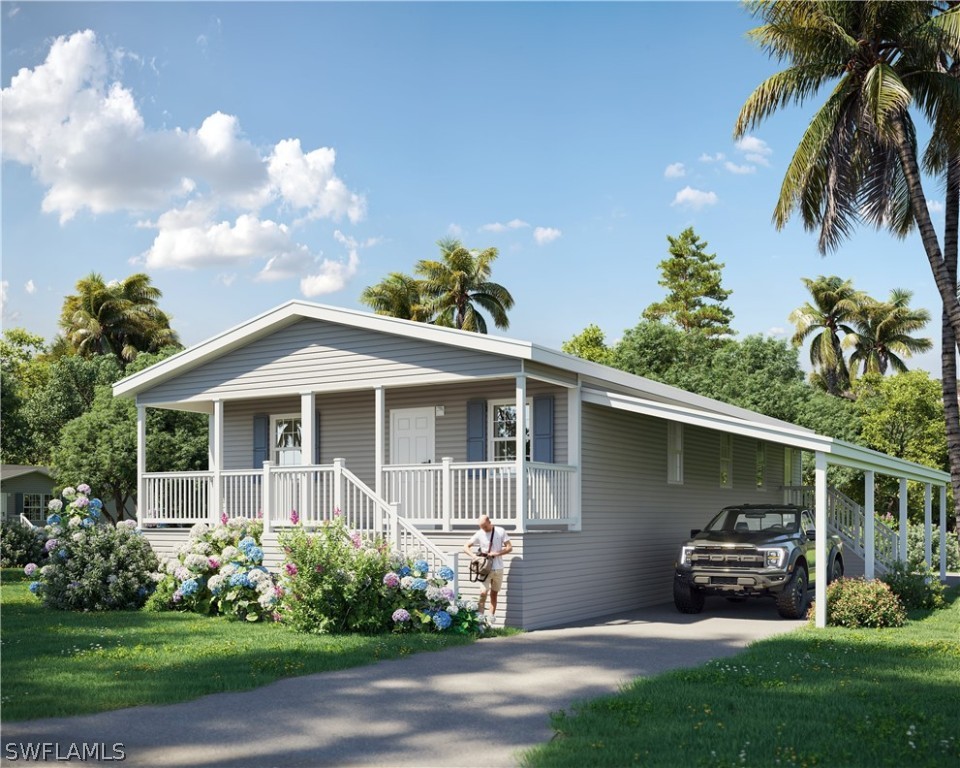 a front view of a house with a garden