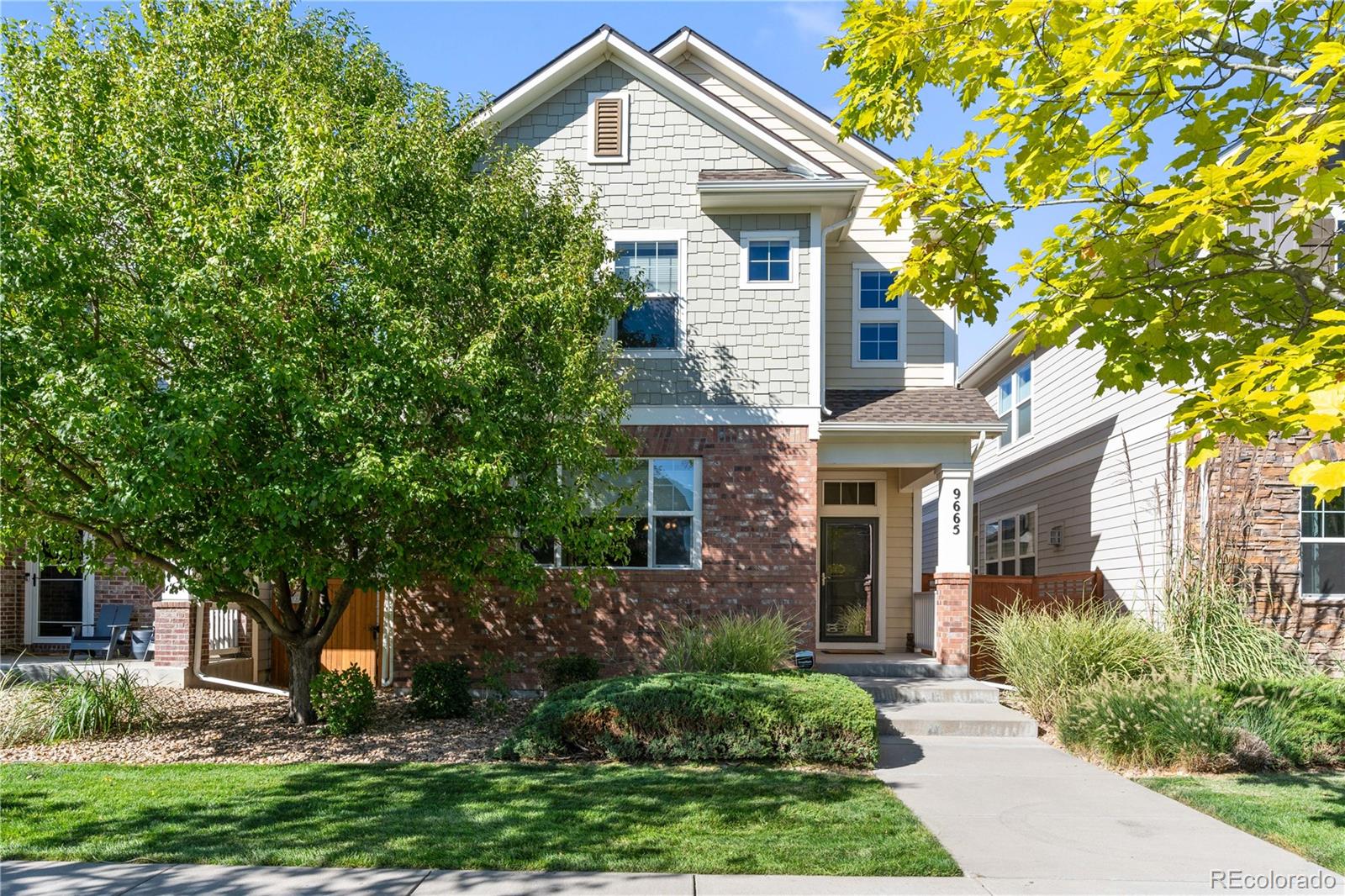 front view of a house with a yard