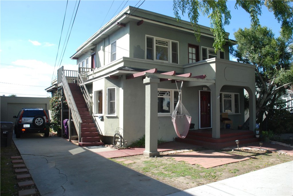 a front view of a house with parking area